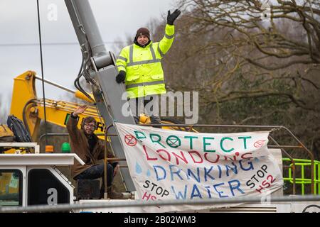 Partially sighted Paralympian James Brown (left) joins climate activists who has occupied a drilling rig in the HS2 compound off the Harvil Road in the Colne Valley park, near Uxbridge. Stock Photo