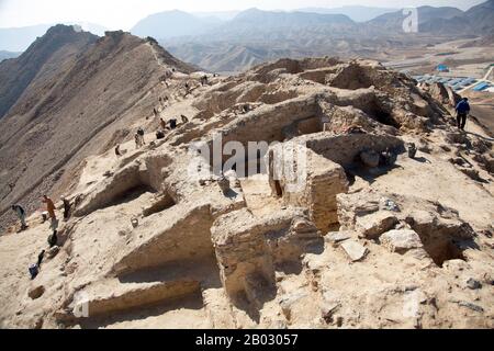 About 30 kms from Kabul, Mes Aynak, is a trove of Buddhist monastery ruins, statues, and stupas attesting to the prolific role that Afghanistan played in the proliferation of Buddhism in Central and East Asia. Currently being excavated as a copper mine, rescue excavations began in 2009. Work was undertaken by the National Institute of Archaeology and the Delegation Archeologique Francaise en Afghanistan. Part of the monastic compound was excavated, leading to the discovery of a vaulted chapel, monks’ cells and storerooms.  Polychrome terracotta statues were also found, including a sleeping Bud Stock Photo