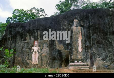 The remote ancient Buddhist site of Bururuvagala (which means ‘stone Buddha images’ in Sinhalese) is thought to date from the 10th century, when Mahayana Buddhism dominated parts of Sri Lanka. Carved into the rock face is a huge 16m-high Buddha figure, with three smaller figures on either side.  Avalokiteśvara ('Lord who looks down') is a bodhisattva who embodies the compassion of all Buddhas. Portrayed in different cultures as either male or female, Avalokiteśvara is one of the more widely revered bodhisattvas in mainstream Mahayana Buddhism, as well as unofficially in Theravada Buddhism. Stock Photo