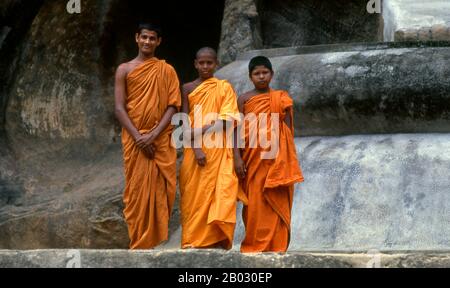 The remote ancient Buddhist site of Bururuvagala (which means ‘stone Buddha images’ in Sinhalese) is thought to date from the 10th century, when Mahayana Buddhism dominated parts of Sri Lanka. Carved into the rock face is a huge 16m-high Buddha figure, with three smaller figures on either side. These are thought to represent the Maitreya Buddha, Avalokitesvara and his consort Tara, as well as the Hindu god Vishnu. Stock Photo