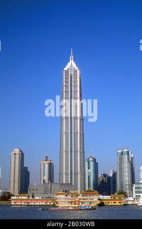 The Jin Mao Tower, at 421m (1,381ft) was until 2007 the highest building in China. Its postmodern form, whose complexity rises as it ascends, draws on traditional Chinese architecture such as the tiered pagoda, gently stepping back to create a rhythmic pattern as it rises.  Shanghai began life as a fishing village, and later as a port receiving goods carried down the Yangzi River. From 1842 onwards, in the aftermath of the first Opium War, the British opened a ‘concession’ in Shanghai where drug dealers and other traders could operate undisturbed. French, Italians, Germans, Americans and Japan Stock Photo