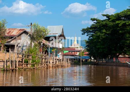 Inle Lake is a freshwater lake located in the Nyaungshwe Township of Taunggyi District of Shan State, part of Shan Hills in Myanmar (Burma). It is the second largest lake in Myanmar with an estimated surface area of 44.9 square miles (116 km2), and one of the highest at an altitude of 2,900 feet (880 m).  The people of Inle Lake (called Intha), some 70,000 of them, live in four cities bordering the lake, in numerous small villages along the lake's shores, and on the lake itself. The entire lake area is in Nyaung Shwe township. The population consists predominantly of Intha, with a mix of other Stock Photo