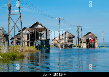 Inle Lake is a freshwater lake located in the Nyaungshwe Township of Taunggyi District of Shan State, part of Shan Hills in Myanmar (Burma). It is the second largest lake in Myanmar with an estimated surface area of 44.9 square miles (116 km2), and one of the highest at an altitude of 2,900 feet (880 m).  The people of Inle Lake (called Intha), some 70,000 of them, live in four cities bordering the lake, in numerous small villages along the lake's shores, and on the lake itself. The entire lake area is in Nyaung Shwe township. The population consists predominantly of Intha, with a mix of other Stock Photo