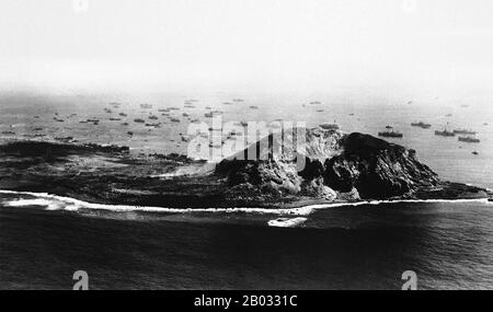 The invasion of Iwo Jima began on February 19, 1945, and continued to March 27, 1945. The battle was a major initiative of the Pacific Campaign of World War II. The Marine invasion was charged with the mission of capturing the airfields on the island, which up until that time had harried U.S. bombing missions to Tokyo. Once the bases were secured, they could then be of use in the impending invasion of the Japanese mainland.  The battle was marked by some of the fiercest fighting of the War. The Imperial Japanese Army positions on the island were heavily fortified, with vast bunkers, hidden art Stock Photo