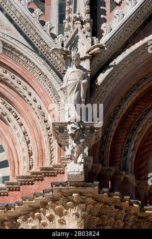 The Cathedral of Saint Mary of the Assumption was originally designed and completed between 1215 and 1263 on the site of an earlier structure. It has the form of a Latin cross with a slightly projecting transept, a dome and a bell tower.  The dome rises from a hexagonal base with supporting columns. The lantern atop the dome was added by Gian Lorenzo Bernini. The nave is separated from the two aisles by semicircular arches. The exterior and interior are constructed of white and greenish-black marble in alternating stripes, with addition of red marble on the façade. Stock Photo