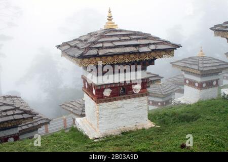 The Dochula Pass is a Bhutanese mountain pass located on the road from Thimphu to Punakha. Within the pass there are 108 memorial 'chortens' or stupas, known as the 'Druk Wangyal Chortens', built by the eldest Queen Mother, Ashi Dorji Wangmo, in honour of Bhutanese soldiers killed in the December 2003 battle against Assamese insurgents from India.  There is also a monastery located in the pass, the Druk Wangyal Lhakhang (temple), built in honour of Jigme Singye Wanghuck, the fourth Druk Gyalpo (head of state), as well as the Royal Botanical Park, the first to be established in Bhutan. Stock Photo