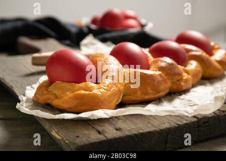 Tasty easter bread. East.Close-uper bread and red eggs. Italian easter bread Stock Photo