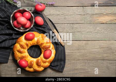 Italian easter bread. Red eggs. Delicious Easter cake. Italy. View from above. Place for text Stock Photo