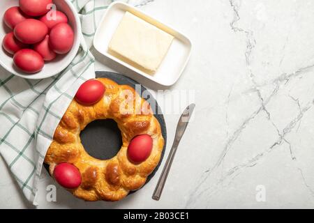 Tasty easter bread. Easter bread and red eggs. Italian easter bread.Place for text Stock Photo