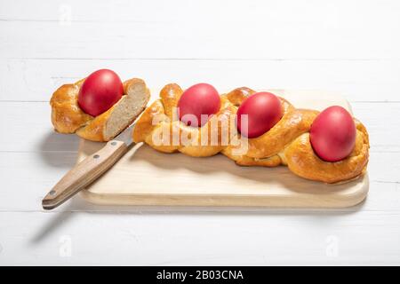 Tasty easter bread. Easter bread and red eggs. Italian easter bread Stock Photo