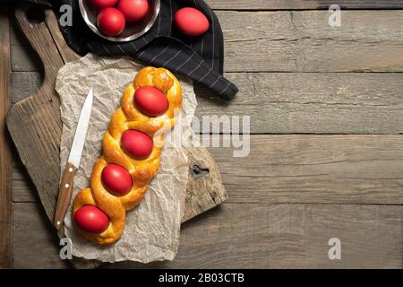 Italian easter bread. Red eggs. Delicious Easter cake. Italy.View from above. Place for text Stock Photo