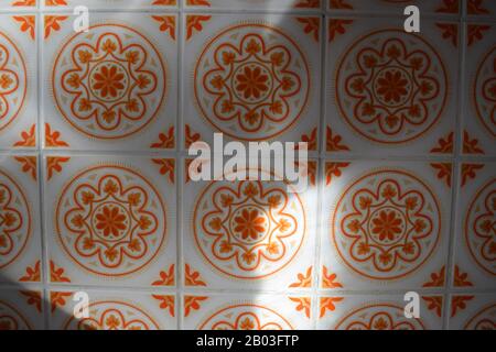 orange on white floral wall decor Stock Photo