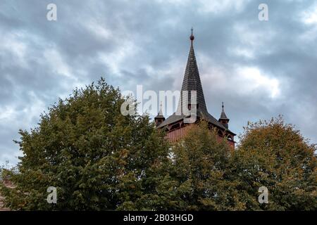 The bell tower of the Hungarian Reformed church in Kalotaszentkiraly / Sancraiu Stock Photo