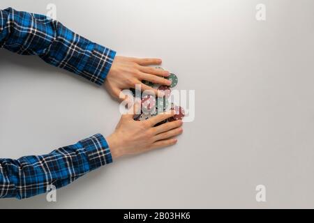 a view frob above, player wins a game in casino and grab all the chips on the table, jackpot Stock Photo