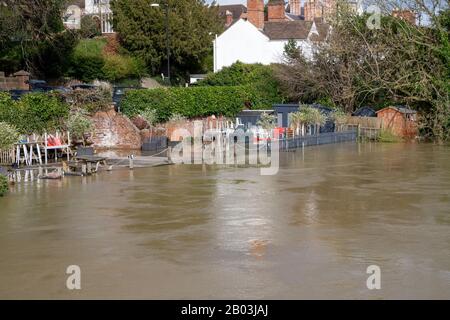 Flooding of the River Severn in Shrewsbury, UK. Flooding the Quarry Park , a children's play area and The Boathouse Pub. Stock Photo