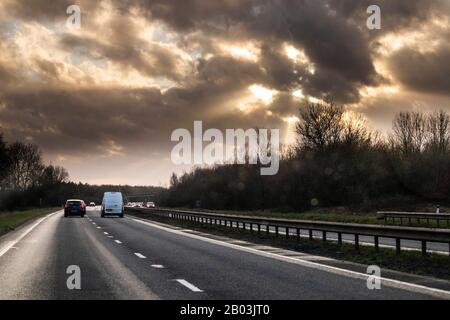 A passenger's view of Storm Dennis gradually clearing while travelling west on the A42 in Leicestershire UK on 16/2/2020 Stock Photo