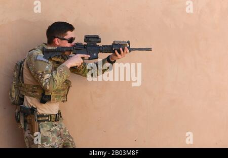 U.S. Air Force Senior Airman Steven Chaney, 409th Expeditionary Security Forces Squadron Response Force, conducts building clearing procedures during a close quarters battle refresher course at Nigerian Air Base 201 February 5, 2020 in Agadez, Niger. Stock Photo