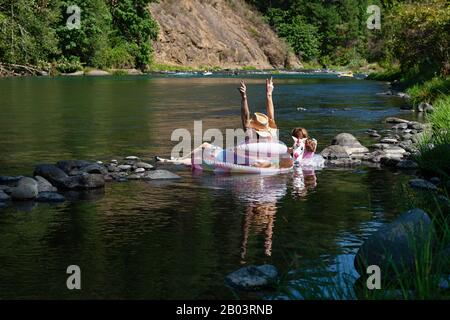 People hanging out on the North Santiam River, Oregon Stock Photo