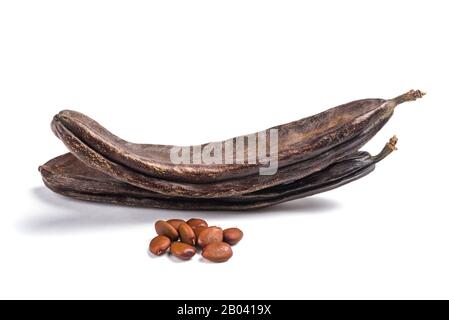 Carobs pods with beans isolated on white background Stock Photo