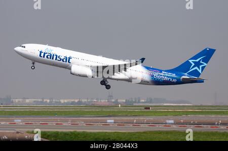 Paris / France - April 24, 2015: Air Transat Airbus A330-200 C-GTSN passenger plane departure and take off at Paris Charles de Gaulle Airport Stock Photo