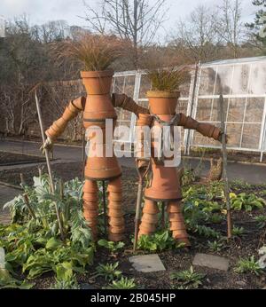 Two Scarecrows Made from Vintage Terracotta Flower Pots in the Vegetable Garden at Rosemoor in Rural Devon, England, UK Stock Photo