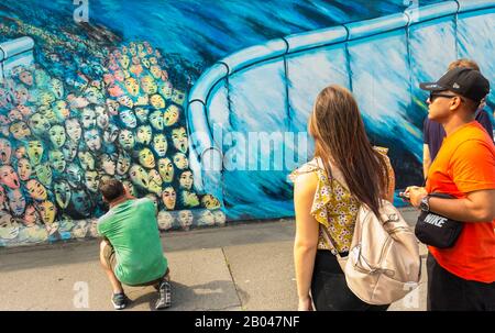 visitors at east side gallery Stock Photo