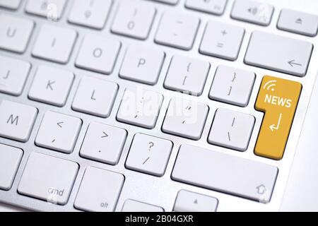 keyboard with colored Enter key and the word "news" on it Stock Photo