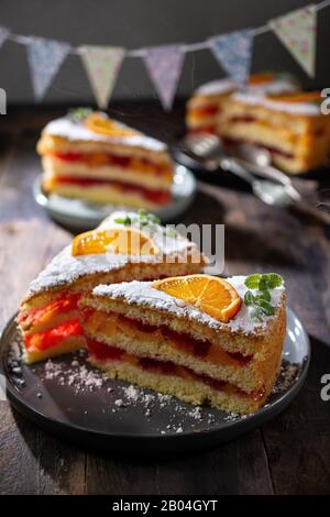 Birthday fruit cake with jelly.Sweet dessert with orange flavour.Healthy food and drink Stock Photo