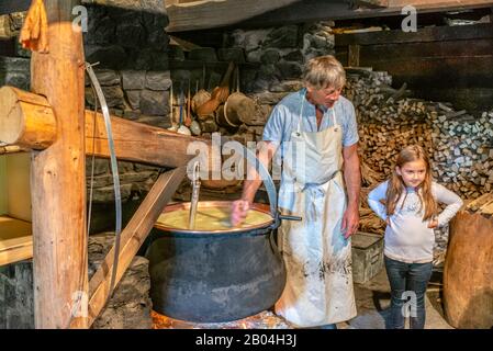 https://l450v.alamy.com/450v/2b04h3j/cheese-maker-with-a-child-in-a-cheese-dairy-at-the-open-air-museum-ballenberg-bern-switzerland-2b04h3j.jpg