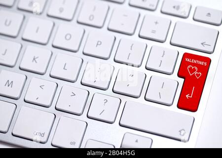 computer keyboard with highlighted red enter key and the message "valentine's day" Stock Photo