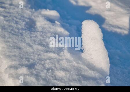 The texture of pure white snow. Fresh snow surface. Stock Photo