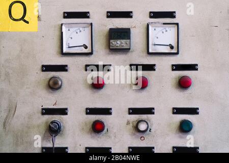Control panel industrial machine with push-buttons and ammeters and meters Stock Photo