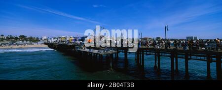 Tourists on a boardwalk, Santa Monica Pier, Santa Monica, California, USA Stock Photo