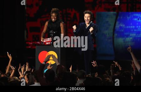 Clara Amfo and Niall Horan on stage at the Brit Awards 2020 at the O2 Arena, London. Stock Photo