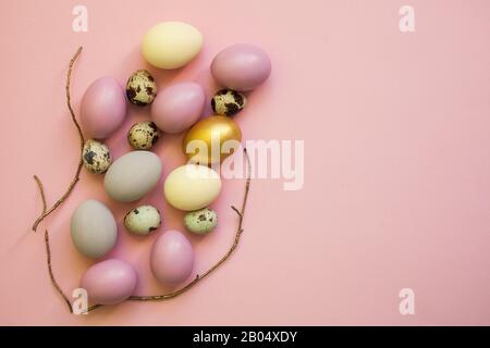 Easter eggs colorful on pink background, flat lay, top view, card for Easter Stock Photo