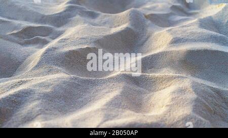 White sand on the beach as background. Sand Texture. Tropical beach concept. Stock Photo