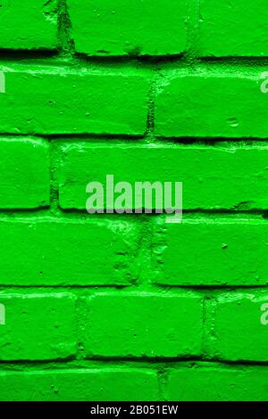 Brick wall as a texture painted in green. Vertical. Stock Photo