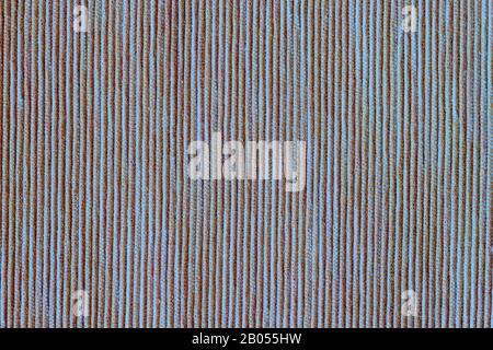 Painted canvas in mixed brown blue color, sackcloth or burlap with large visible texture. Close up of jute, striped vertical texture Stock Photo