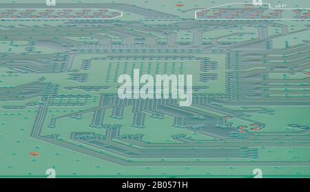 Close-up circuit board with electronics on the back of the panel. Tracks on the board. The world of electronics. Stock Photo