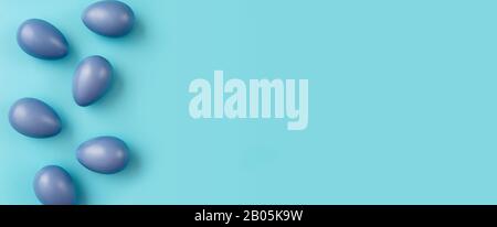 Simple composition with blue Easter eggs on trendy colorful background Stock Photo