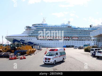 Yokohama, Japan. 18th Feb, 2020. An ambulance car leaves from a cruise ship Diamond Princess at the Daikoku pier in Yokohama, sububan Tokyo on Tuesday, February 18, 2020. 88 more people on the Diamond Princess have tested positive for the new coronavirus COVID-19 on February 18, total 542 passengers and crews have found at the ship. Credit: Yoshio Tsunoda/AFLO/Alamy Live News Stock Photo