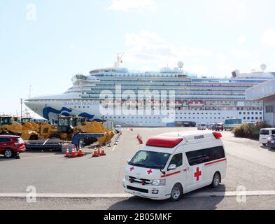 Yokohama, Japan. 18th Feb, 2020. An ambulance car leaves from a cruise ship Diamond Princess at the Daikoku pier in Yokohama, sububan Tokyo on Tuesday, February 18, 2020. 88 more people on the Diamond Princess have tested positive for the new coronavirus COVID-19 on February 18, total 542 passengers and crews have found at the ship. Credit: Yoshio Tsunoda/AFLO/Alamy Live News Stock Photo