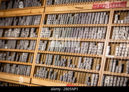 Moveable type Chinese characters organized on shelves , Shanghai, China Stock Photo