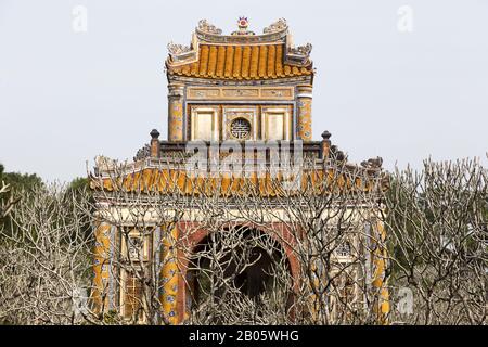 Stele Pavilion Archway Gate, hosting stone tablet with Emperor Biography. Tu Duc Royal Tomb Necropolis in Hue, Vietnam; a UNESCO World Heritage Site Stock Photo