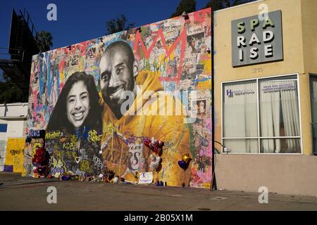 General overall view of Kobe Bryant memorial mural at Sparadise La Brea at 1251 St. La Brea Ave., Sunday, Feb 16, 2020, in Los Angeles. The mural, created street artist Thierry Guetta aka Mr. Brainwash, showcases Bryant and his daughter Gigi Bryant (Gianna Bryant), with the former basketball player wearing a Lakers sweatshirt against a colorful background and newspaper images of Bryant during his NBA years, on the front. There is another image of Bryant in his purple Lakers uniform with a quote of his written next to him on the side of the building. This mural also pays tribute to the other se