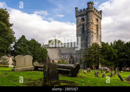Culross, Scotland  - September 16 2019: Headstones in the Cemetery with Culross Abbey in the background in Dunfermline, Fife UK September 16,  2019 Stock Photo