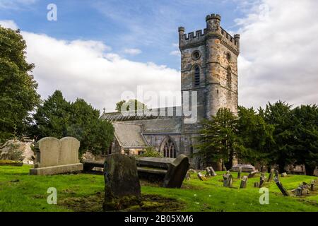 Culross, Scotland  - September 16 2019: Headstones in the Cemetery with Culross Abbey in the background in Dunfermline, Fife UK September 16,  2019 Stock Photo