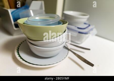 Dishes and bowls in kitchen Stock Photo