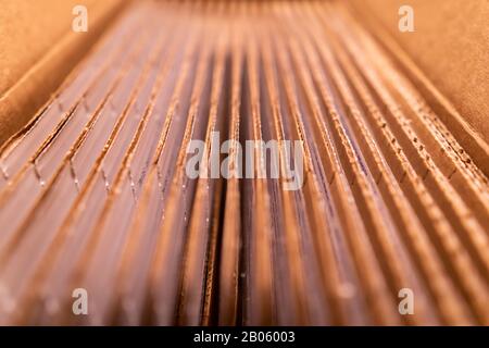 A pack of cardboard boxes under warm light Stock Photo