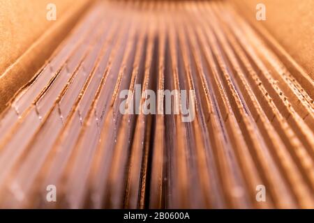 A pack of cardboard boxes under warm light Stock Photo